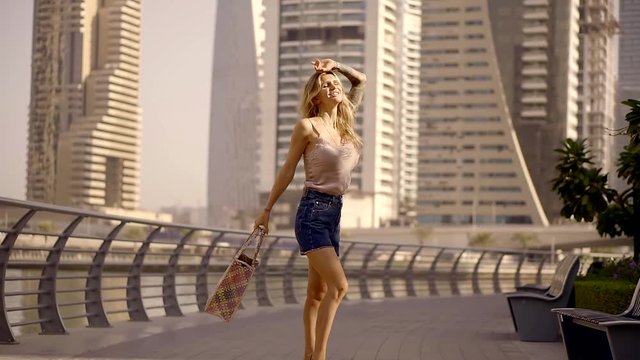 beautiful fashion girl walking around the metropolis