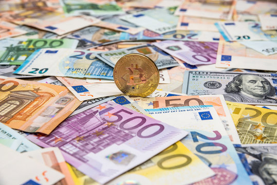 Bitcoin on dollar and euro banknotes