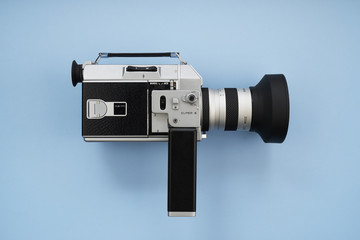 Super 8 Movie Film Camera on Blue Background