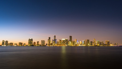 Fototapeta na wymiar USA, Florida, Dawning atmosphere over the skyline of the city miami from water with light reflections and stars