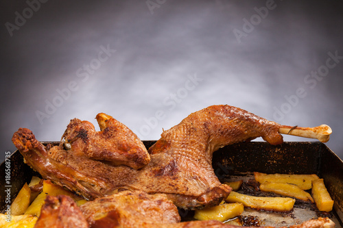 500px x 334px - Roast chicken with potatoes. Black background. Porn food ...