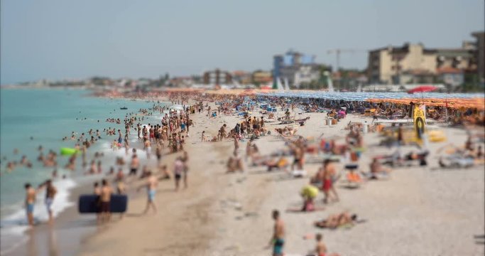 4K Tilt Shift / time-lapse of a busy beach in August, Adriatic sea, Italy