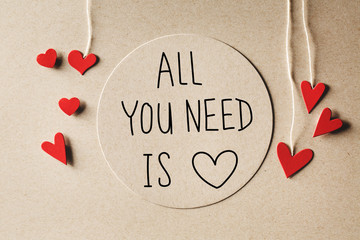 All You Need Is Love message with handmade small paper hearts