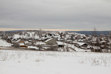 view from the mountain to a snow-clad city
