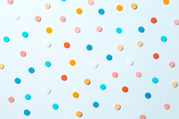 Confetti. Colorful dots view from above on a light background. Top view