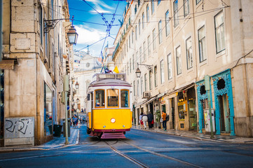 Yellow tram 28 on streets of Lisbon, Portugal - obrazy, fototapety, plakaty