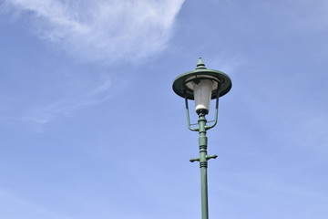 Fototapeta na wymiar Vintage lamp and blue sky