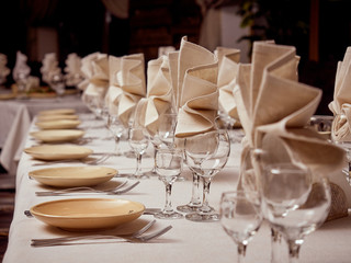 Cloth napkins in glasses.