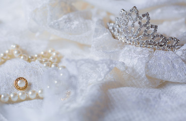Tiara and white pearls with wedding dress