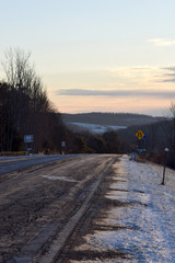 Obraz premium Ice-Covered Country Road at Dawn