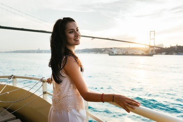 Beautiful girl smiles on a ship