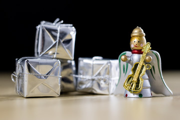 Christmas decorations made of wood on a wooden table. Christmas decorations and small Christmas presents.