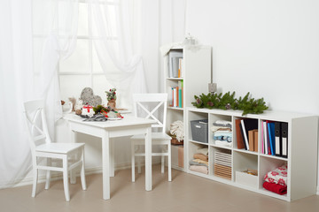 white room interior with christmas decoration, window, table and chair