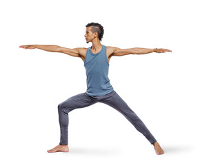 Young man doing yoga isolated on white