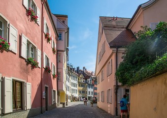 Fototapeta na wymiar Picture of a narrow alley in the city of Lindau at the Lake Constance or Bodensee in southern Germany
