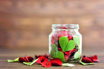  Heart shaped leaf in the jar. Valentines Day card concept. 