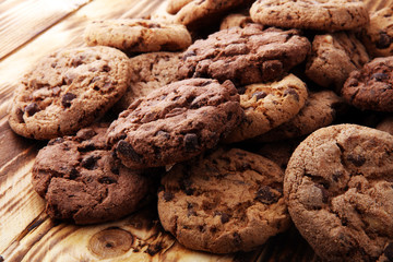 Chocolate cookies on wooden table. Chocolate chip cookies shot