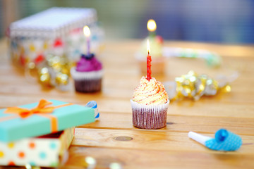 Birthday party with colorful decoration and cakes with candles