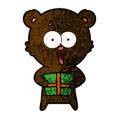 laughing teddy  bear with christmas present