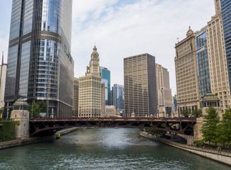The Wabash Avenue Bridge with traffic and Lake Michigan River surrounded by financial buildings, Chicago, IL, USA on the 3th of August, 2017