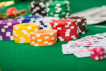 Poker chips and banknotes on table in casino