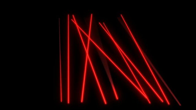 Bright red laser beams moving in black studio. Dance club lights.