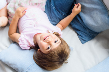 Portrait of a pretty smilling little baby girl at home