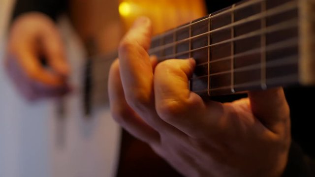 4k Guitarist plays with acoustic classic guitar music at studio recording close-up
