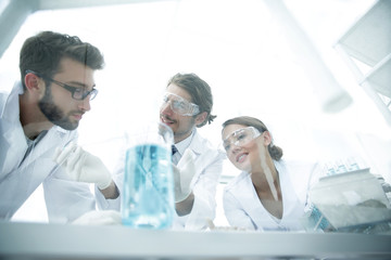 Group of scientists working on an experiment at the laboratory