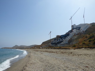 Fototapeta na wymiar Algarrobico en Cabo de Gata, playa española de Carboneras,Mojácar. Situada en Cabo de Gata-Níjar conocida por un hotel ilegal