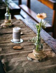 Wedding decoration on the table, tablecloth and other decoration made of burlap