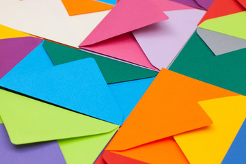 Different colored envelopes on the desk