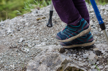child's feet walk along the mountain path