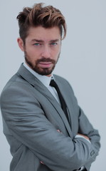 Close up portrait of a smiling handsome business man  over white