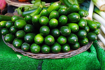 Pile of green zucchini summer squash at the farmers market