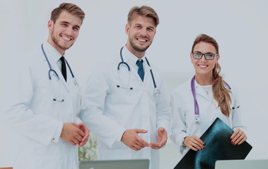 Fototapeta premium A group of doctors examining an x-ray in the hospital