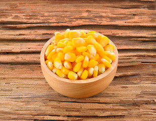 Corn on wooden background