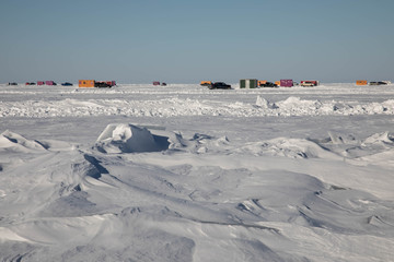 Colorful ice fishing shacks on Lake of the Woods, Minnesota