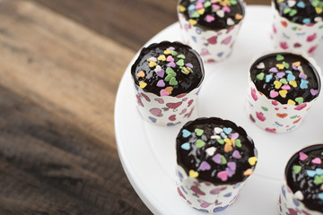 homemade cupcakes on wooden table