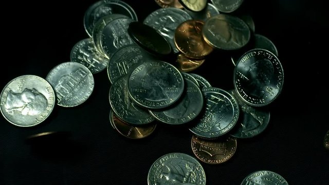 US Coins Falling Over Dark Cloth Slow Motion 1000fps