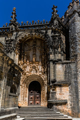 Fototapeta na wymiar The main entrance of the Convent of Christ in Tomar, Portugal, built in the Manueline style.