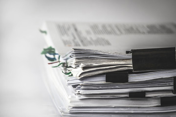 the extreamely close up  report paper stacking of office working document , retro color tone