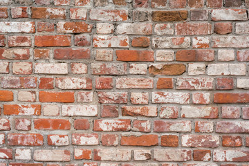 Brick wall, old texture of red stone blocks. Background.