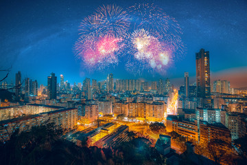 Double exposure of fireworks and Hong Kong city