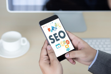 Local SEO Concept Business team hands at work with financial reports Links Global Hyperlink search engine optimization and a laptop