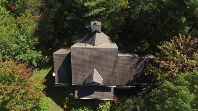 industrial pressure washing aerial view of water hitting the home 4k