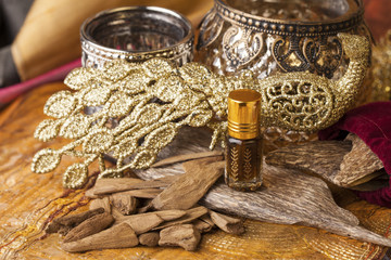 Agarwood, also called aloeswood, essential oil and incense chips