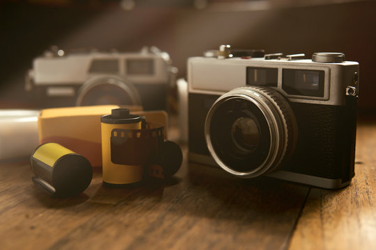 Vintage camera and films on a wooden table