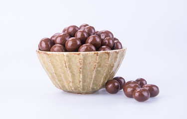 chocolate balls. chocolate balls in bowl on a background