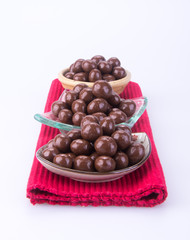 chocolate balls. chocolate balls in bowl on a background